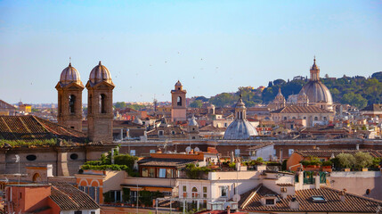 Fototapeta na wymiar Amazing panoramic views of rooftops, church domes, bell towers of Ancient Rome, a breathtaking cityscape, birds soar high in the air
