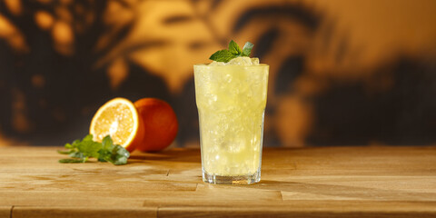Orange juice on wooden desk and free space for your decoration 