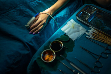 Doctors are using tools to perform patient procedures in the operating room. Medical concept. Background blurred.