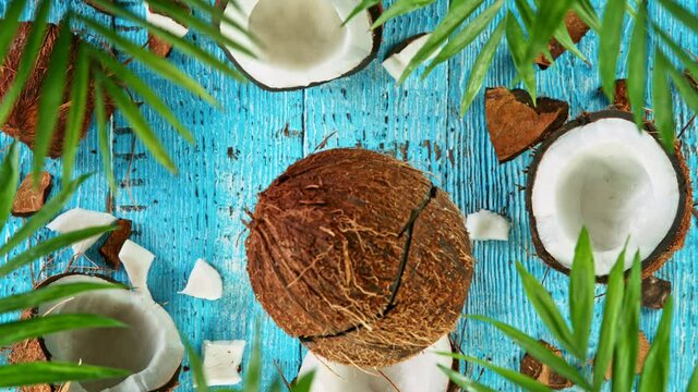 Super Slow Motion Shot of Water Splashing on Coconut at 4K, top shot