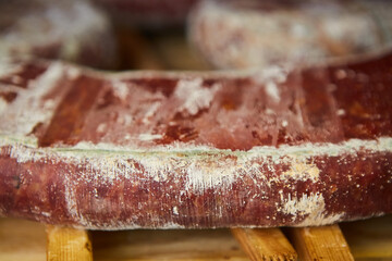 Production line of sausage products. Sausage hanging on the counter of the store. Meat products
