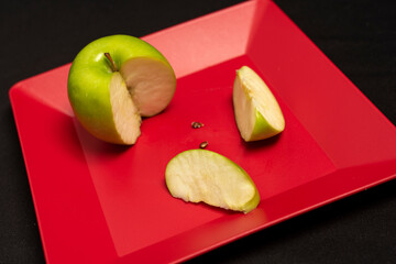 square colored plates with vegetables and fruits