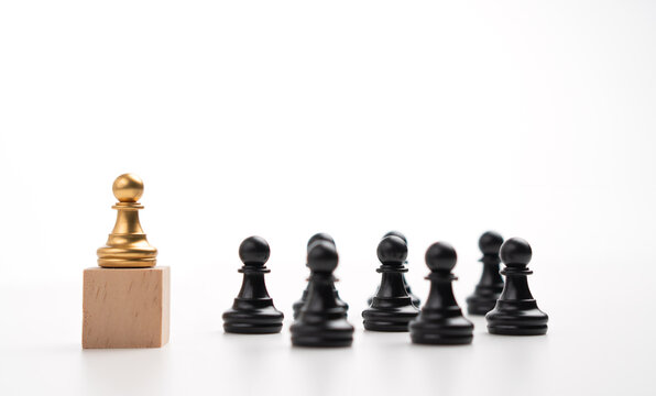 The leadership of the Golden chess pawn standing on the box show influence and empowerment. Concept of business leadership for leader team, successful competition winner and Leader with strategy