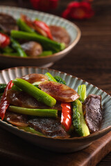 Delicious spicy homemade stir-fried Chinese smoked sausage with asparagus.