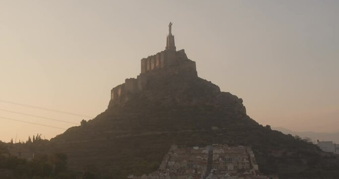 Magnificent Zoom-in Shot of Christ of Monteagudo With the Majestic Golden Sky