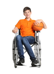 Disabled teenage boy in wheelchair with basketball ball on white background