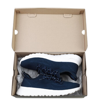 Pair of stylish sport shoes in cardboard box on white background, top view