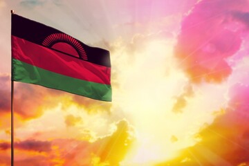 Fluttering Malawi flag in top left corner mockup with the space for your text on beautiful colorful sunset or sunrise background.