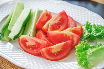 Fresh vegetable salad and appetizer on the dining table.
