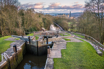 Fototapeta premium Five Rise Locks at the canal in Bingley in evening sunlight
