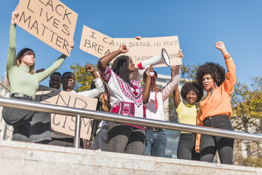 Group of multiethnic people protesting on street
