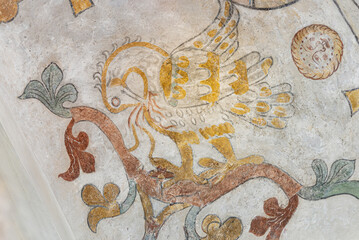the mythological bird Phoenix feeding his nestlings with his own blod, an ancient mural © Stig Alenas
