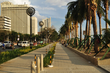 Filipino people and foreign travelers travel visit walking rest relax at Manila baywalk with...