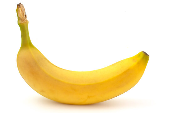 Close-up of one banana lying isolated on white background.