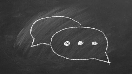 Hand drawing and animated chat speech bubble icons on chalkboard. Symbol of comment or message. - Powered by Adobe
