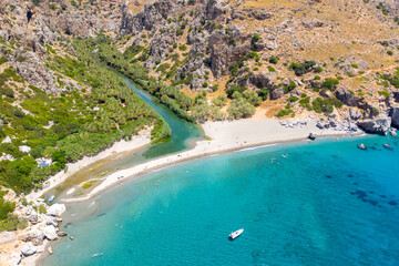 Preveli beach at Libyan sea, river and palm forest, southern Crete , Greece