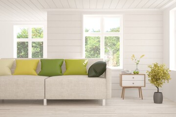 Fototapeta premium Minimalist living room in white color with sofa and summer landscape in window. Scandinavian interior design. 3D illustration