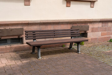 Brown wooden bench in the park