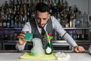 Mixologist making molecular cocktail in bar
