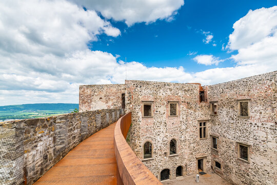 Medieval castle Helfstyn, Czech Republic. Ancient castle in gothic style. Castle walls and interiors, beautiful old tower. Summer weather, blue sky with clouds. Famous trip destination.
