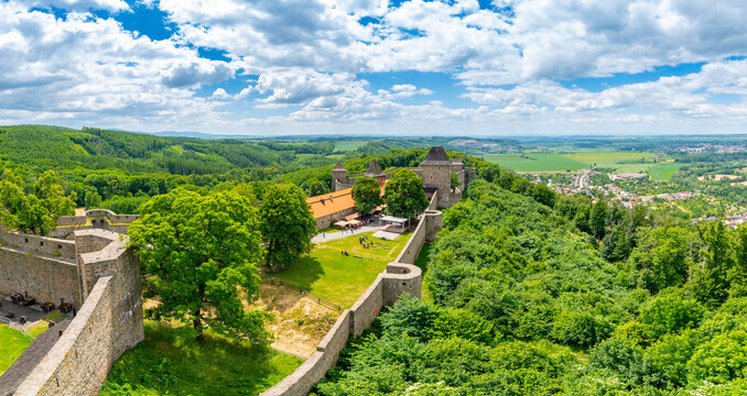 Medieval castle Helfstyn, Czech Republic. Ancient castle in gothic style. Castle walls and interiors, beautiful old tower. Summer weather, blue sky with clouds. Famous trip destination.