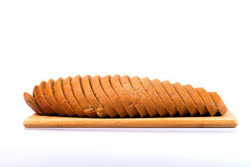 Sliced bread on wooden cutting board isolated on white background. 
