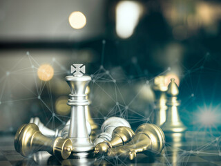 Golden king chess to fighting silver king chess to play successfully in the competition with technology network background. Management or leadership strategy concept.