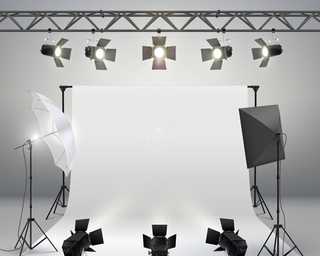 White Backdrop Background for Photography. Professional photo studio interior with professional equipment.