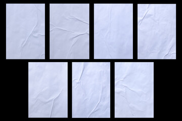 Variety of blank white crumpled and creased sticker glued paper poster texture isolated on black background.