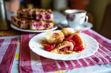 Sweet fruity food, strawberry dumpling, cake and coffee.