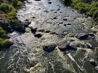The mountain River. A river with rocks and a strong current. Howler threshold Iset River.