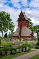 the historic old church in Gamla Uppsala with the cemetery in the foreground