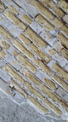 Crumbled bricks in brickwork. Vintage background for site