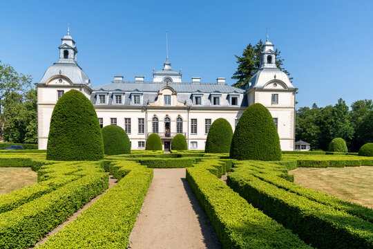 view of the Kronovall Castle and gardens on a summer day under a blue sky