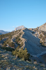 view of the mountain range from above, the mountain range divides the photo in half, the landscape and the dry climate