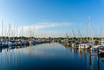 Fototapeta na wymiar view of the marina and yacht harbor in Middelfart in southern Denmark in warm evening light