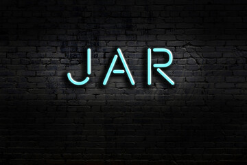 Neon sign. Word jar against brick wall. Night view - obrazy, fototapety, plakaty