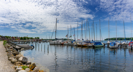 Fototapeta na wymiar view of the harbor front promenade and marina and yacht harbor in Nysted