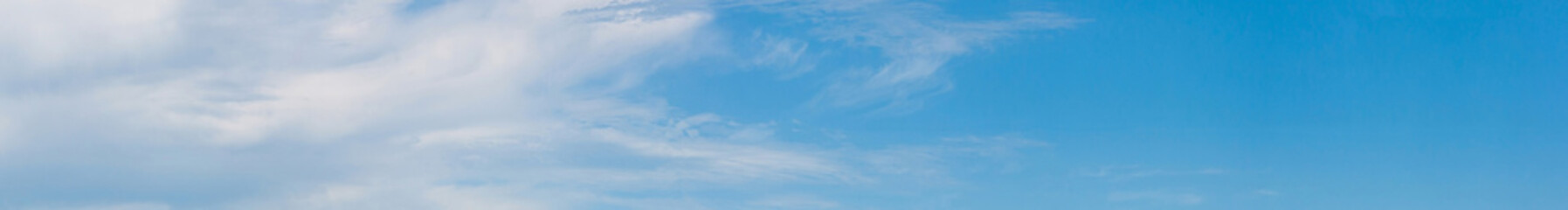 Panorama of the sky, partly with clouds.