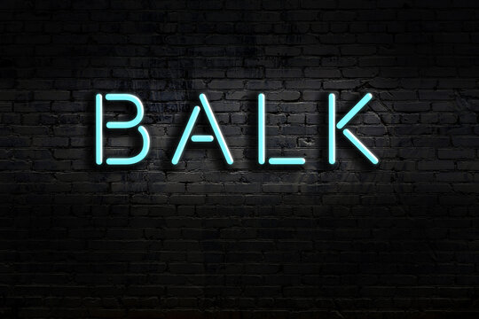Night view of neon sign on brick wall with inscription balk
