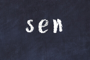 College chalk desk with the word sen written on in © iushakovsky