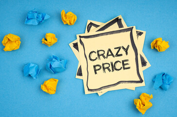 On a blue background, there are pieces of paper and a sticker with the inscription - CRAZY PRICE