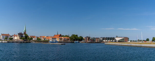 Fototapeta na wymiar panorama cityscape of the harbor and old town of Helsingor in northern Denmark