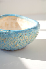 Blue bowl on sunny day