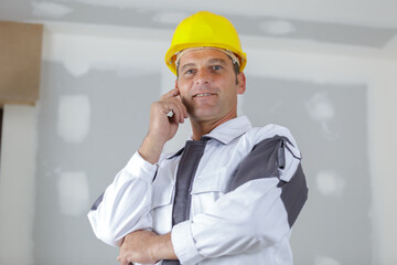 portrait of builder man standing indoors