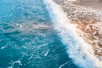 Ocean wave with spray, sea summer. reflection sky