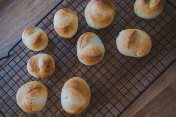 Top view bread rolls on wood.