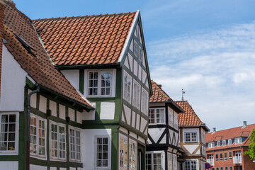 colorful whitewashed half-timbered houses under a blue sky