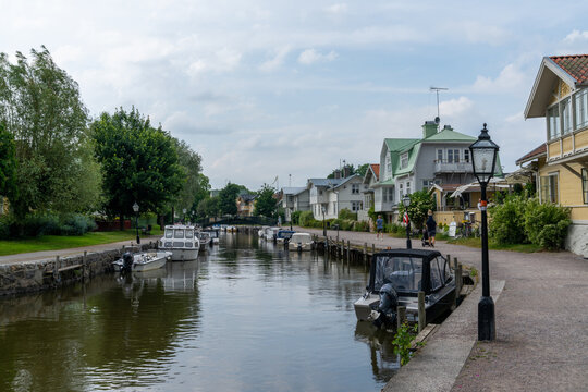 many boats line the canals of the harbor front in the idyllic Swedish village of Trosa
