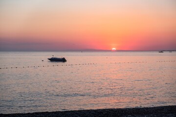 Dusk sea water wave dawn. red sky